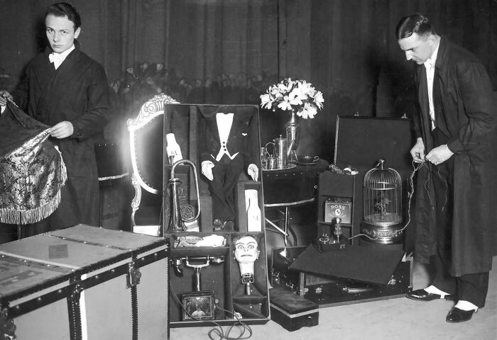 A Pair Of Entertainers Unpacking Their Dummy Friend In 1925