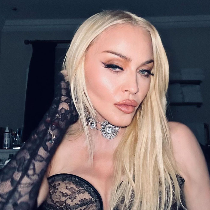 Blonde woman in lace outfit striking a pose, representing pre-cancel culture celebrity moments.