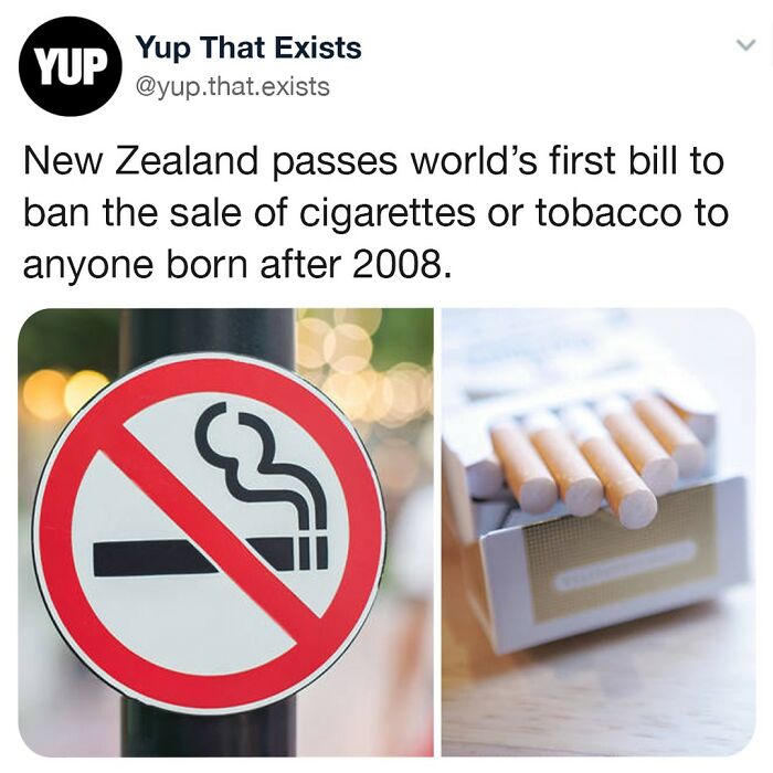 No smoking sign next to an open pack of cigarettes illustrating New Zealand’s tobacco sale ban for post-2008 births.