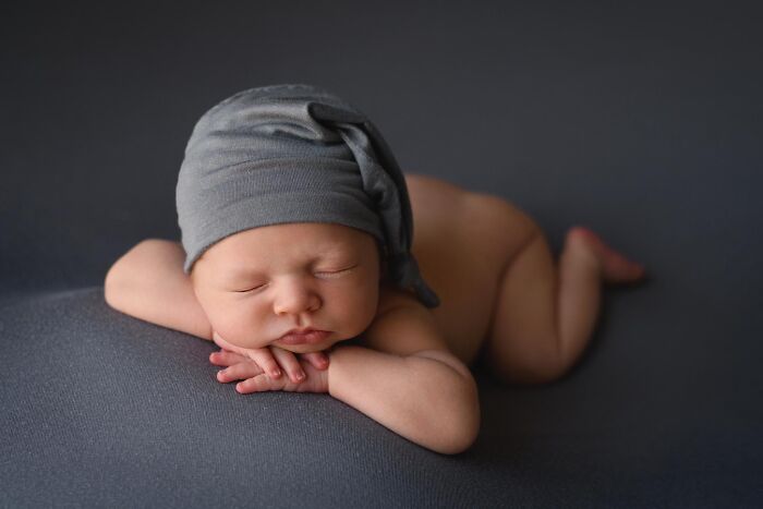 Chin On Hands Newborn Pose