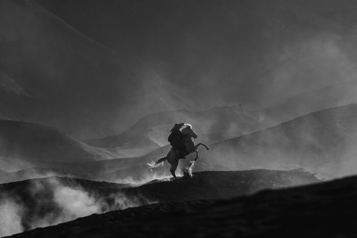 1st Place In The Landscapes Category: "Dust-Laden Hooves: Saga Of The Volcanic Riders" By Mahendra Bakle, India