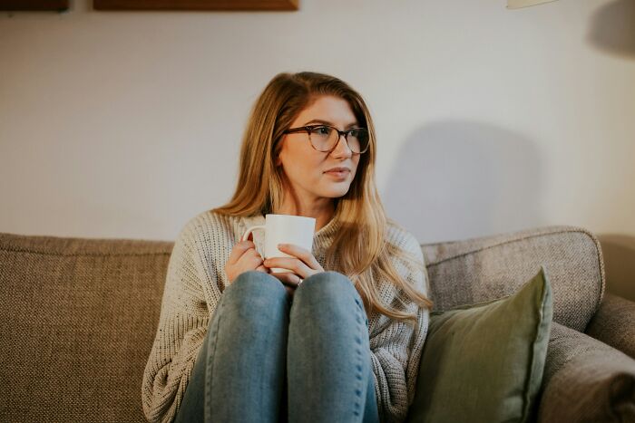 Woman drinking tea and thinking