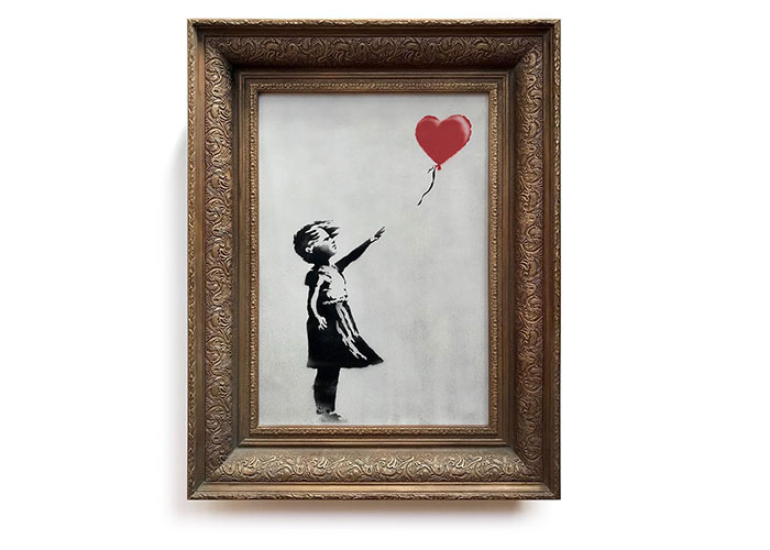 Framed Banksy artwork of a girl reaching for a red heart-shaped balloon, related to famous people declining major awards.