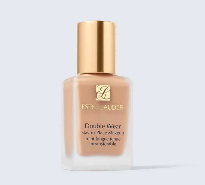 Estée Lauder Double Wear foundation bottle with gold cap, showcasing top beauty brands setting the gold standard.