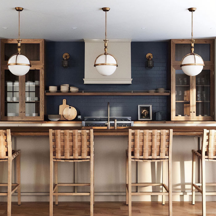 Brown kitchen cabinets near dark blue wall