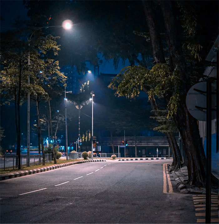 Empty urban street at night under streetlights, capturing a quiet scene related to advice people ignored until they tried it.