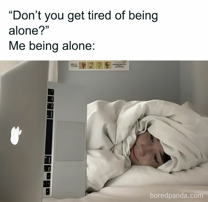 A person wrapped in blankets, using a laptop in bed, illustrating a funny meme from the "Meme Queen" Instagram.