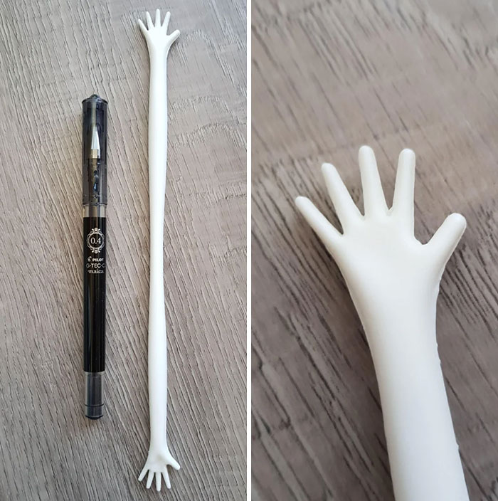 Unusual long white object with tiny hands on both ends, a mysterious object found and compared to a pen for scale.