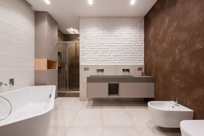 Modern bathroom interior with sleek fixtures and minimalistic design, illustrating advice people thought was a joke until tried.