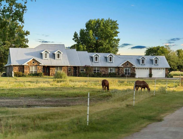 Massive ranch with horse nearby 