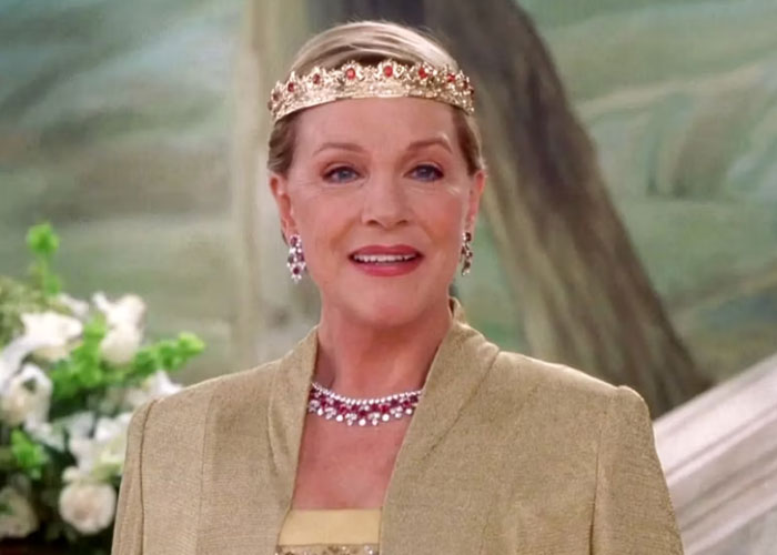 Actress in regal attire and jeweled crown smiling in a scene about famous people declining major awards.