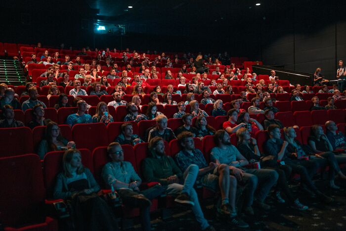 Person watching movie in cinema