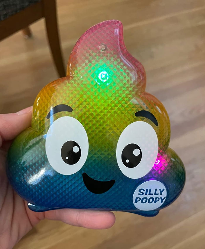 Colorful p**p emoji toy with a smiling face, labeled "Silly Poopy," a fun Valentine's Day gift for kids.