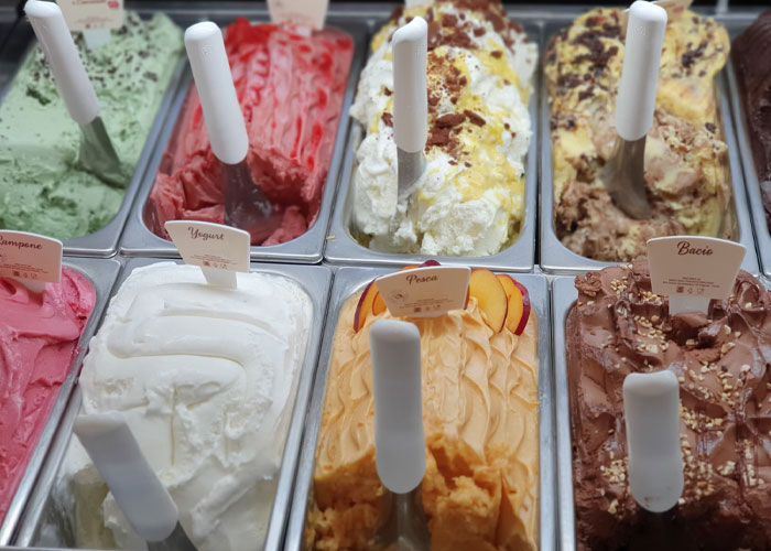 Various colorful gelato flavors displayed in metal trays, illustrating surprising confessions people make late in life.