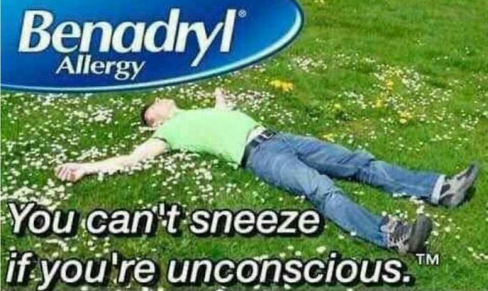 Man lying on grass under Benadryl logo with text "You can't sneeze if you're unconscious." Funny spring meme.