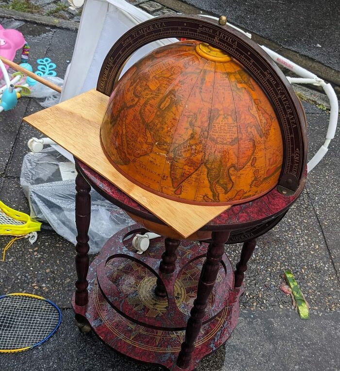 A Globe That Opens Into A Bar (Thus The Globe Bar) Is One Of Our Faves. Here Is One Getting Wet On The Corner Of 135 And Adam Clayton Powell