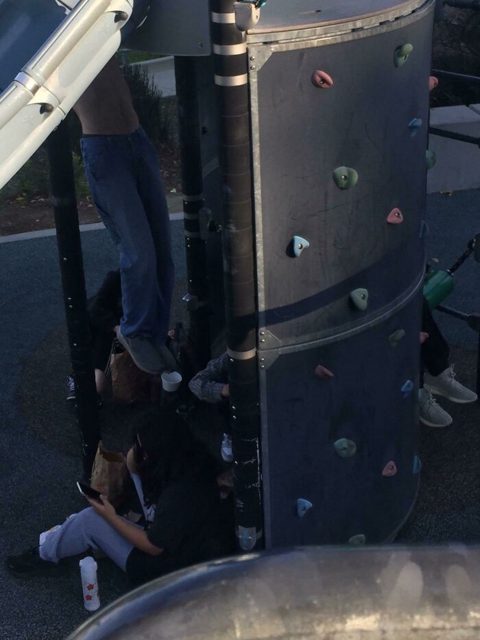 Shirtless, Childless Man Grunts And Exercises At A Playground In The Middle Of A Group Of Girls Eating Right After School
