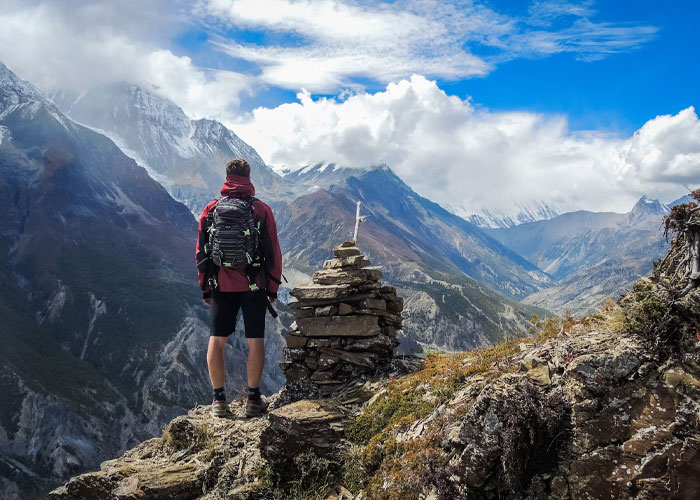 Person over 40 hiking alone in the mountains, symbolizing childfree people over 40 and life choices reflection.