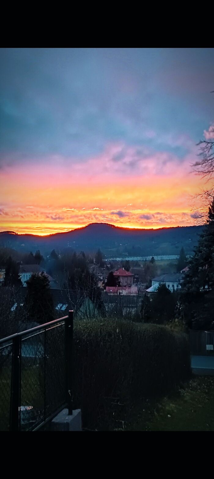 A View Of The Sun Dipping Below The Horizon From My Grandmother's Balcony At Her Garden House