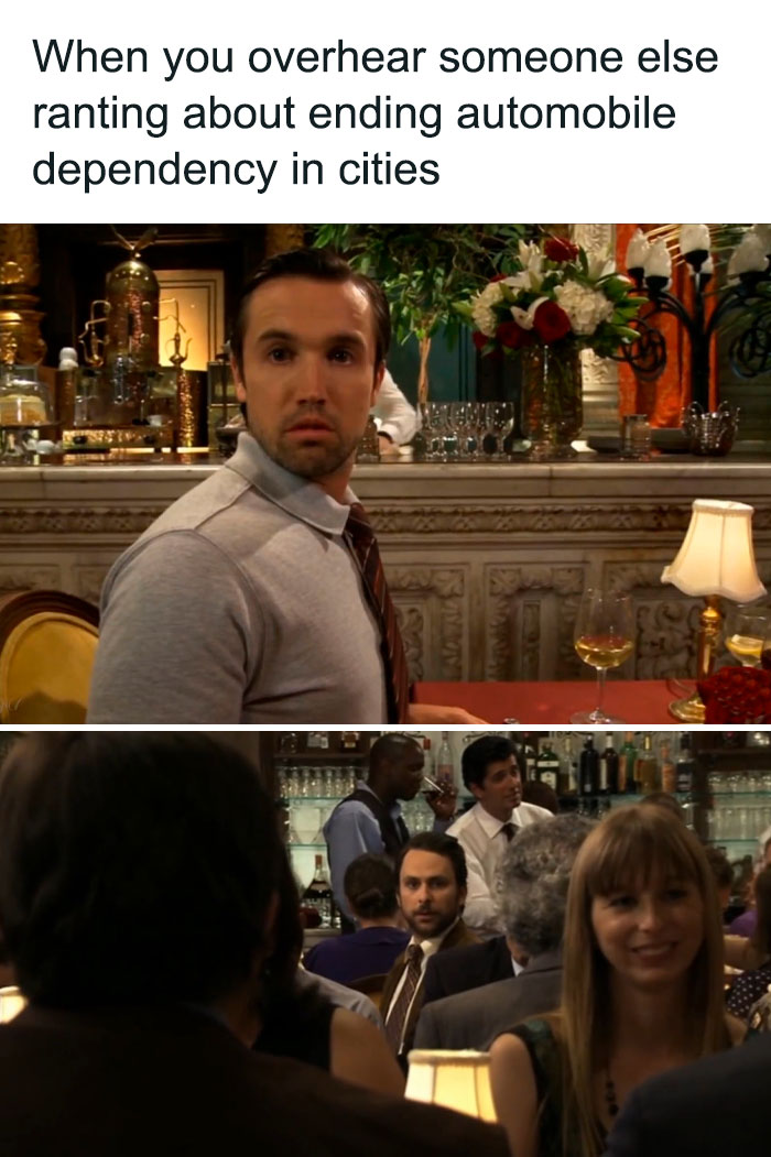 Man overhears conversation on urban planning, appearing surprised in a restaurant setting.