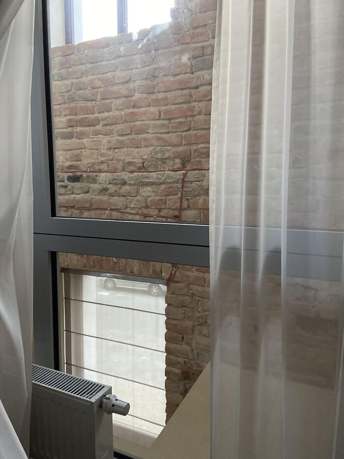 My Hotel Room Window Looks Out To The Wall And Window Of The Original Building