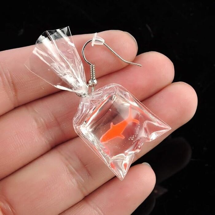 Nothing Can Quite Capture Your Fashion Sense Like The Fish In Bag Earrings. Talk About Making A Splash With Your Style