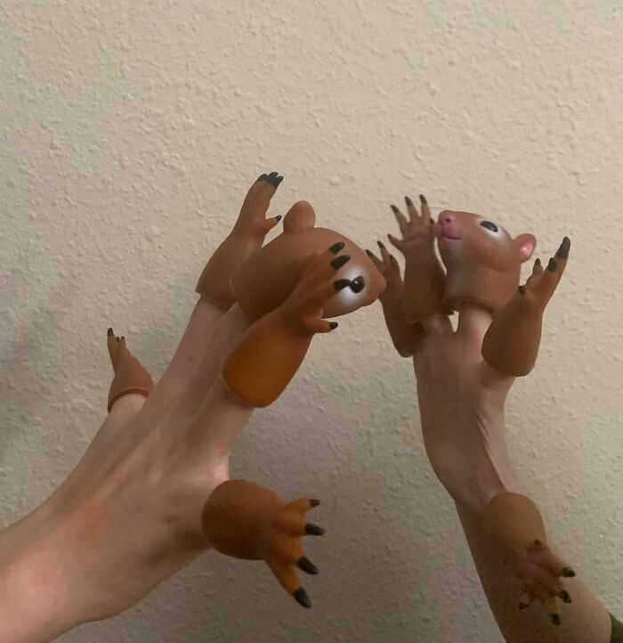 Hands wearing quirky animal finger puppets with claws, one an Amazon find hovering between genius and why does this exist.