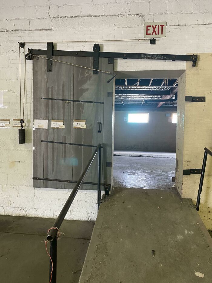 This Old Fire Door. If The Rope Catches Fire It Drops The Weight And The Door Rolls Down The Slanted Tracks To Close
