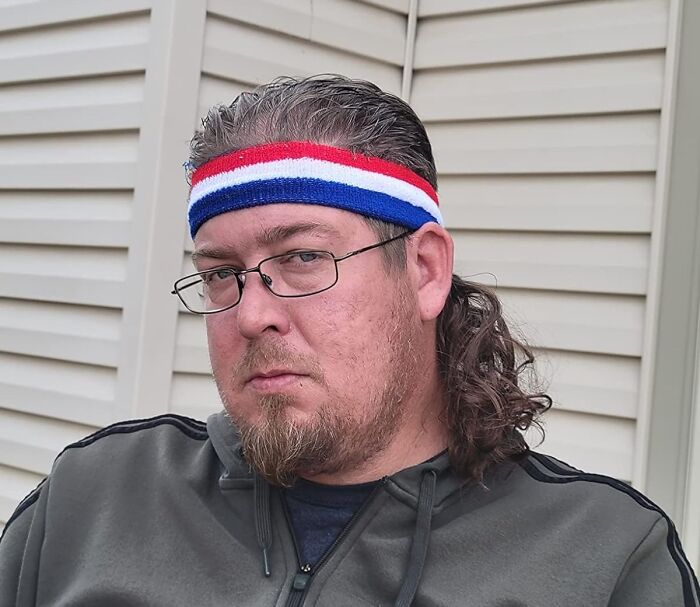 Man wearing a red white and blue headband and glasses, displaying a quirky Amazon find that borders genius and why does this exist.