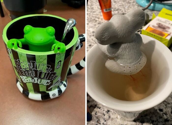 Weird kitchen items: a green frog inside a striped mug and a gray mouse infuser in a cup of tea.
