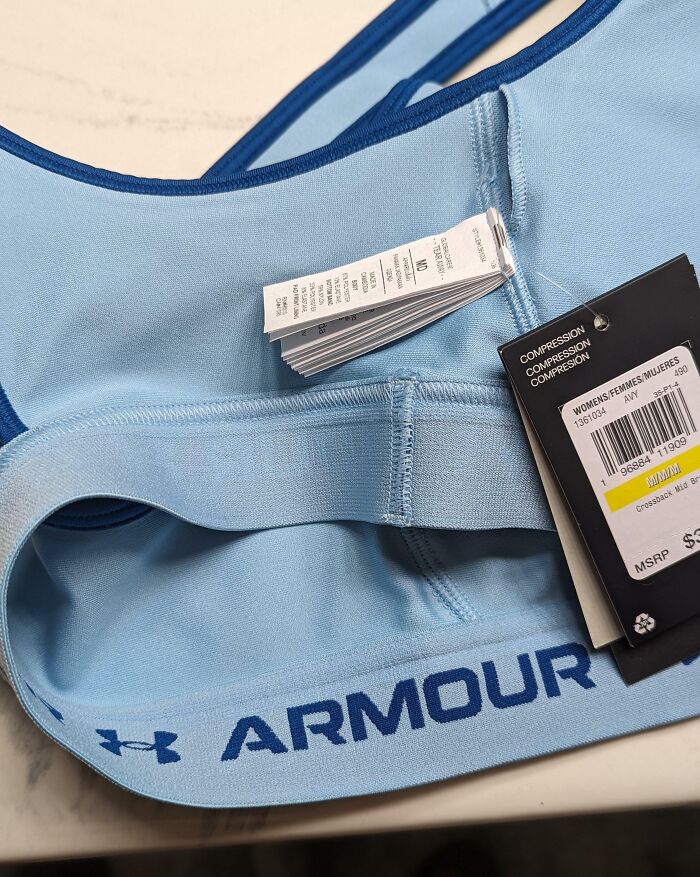 New Sports Bra Comes With Over 20 Tags Sewn In. It Takes Surgical Precision To Remove Them Without Damaging The Bra