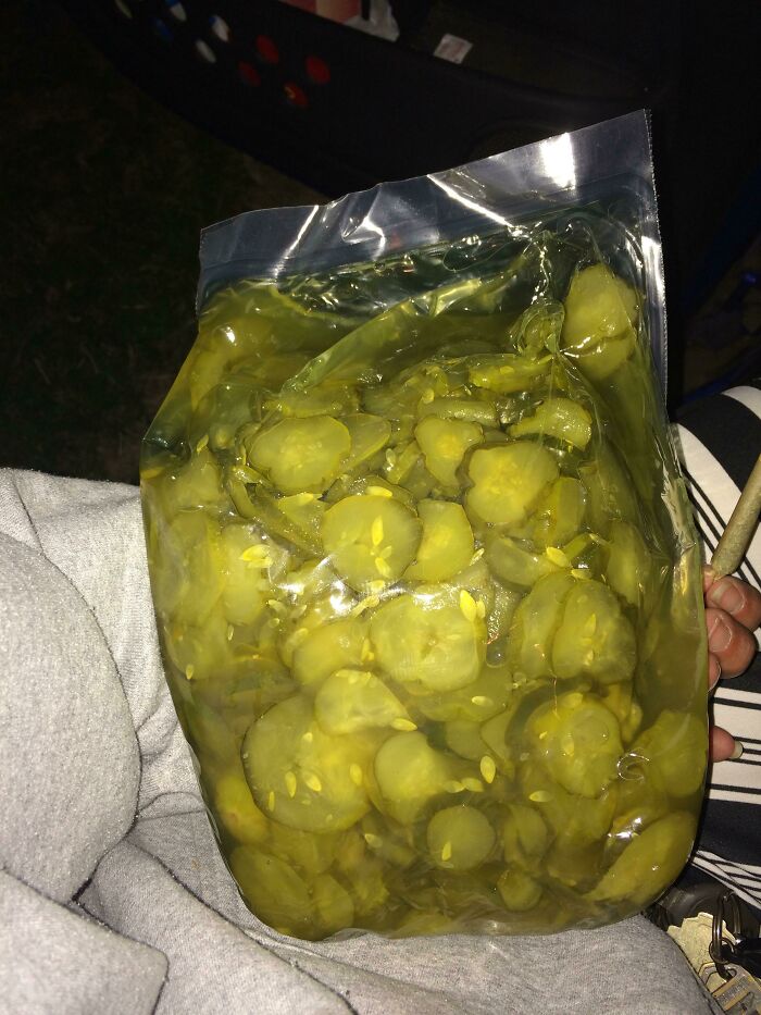 Bag of pickles, a response to a customer request for extra, demonstrating food service workers’ humorous compliance.