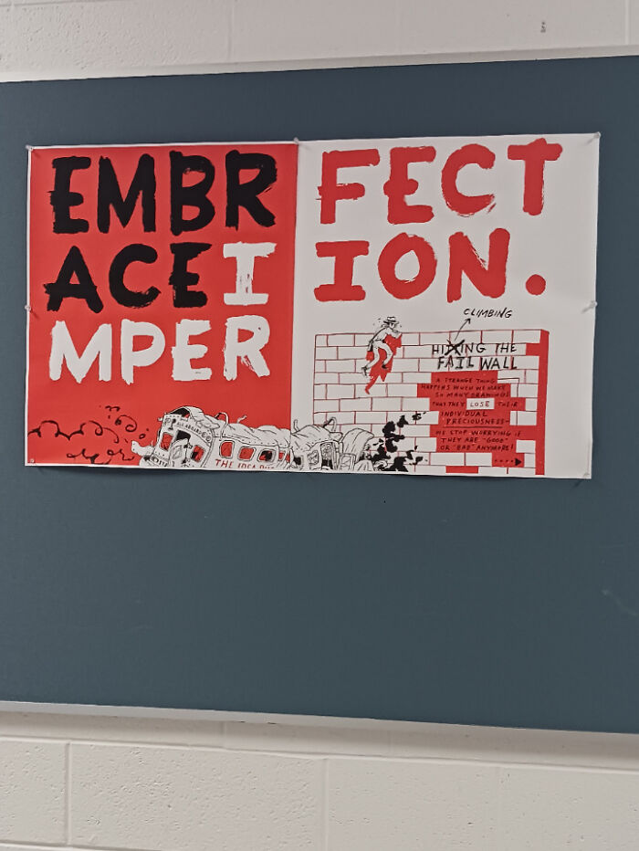 Sign fail with missing letters reads "EMBRACE IMPERFECTION" on a wall, showcasing an unintended message mistake.