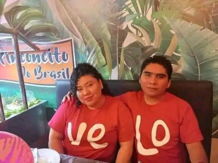 Couple wearing mismatched shirts in restaurant, humorous fail with the keyword "you had one job."
