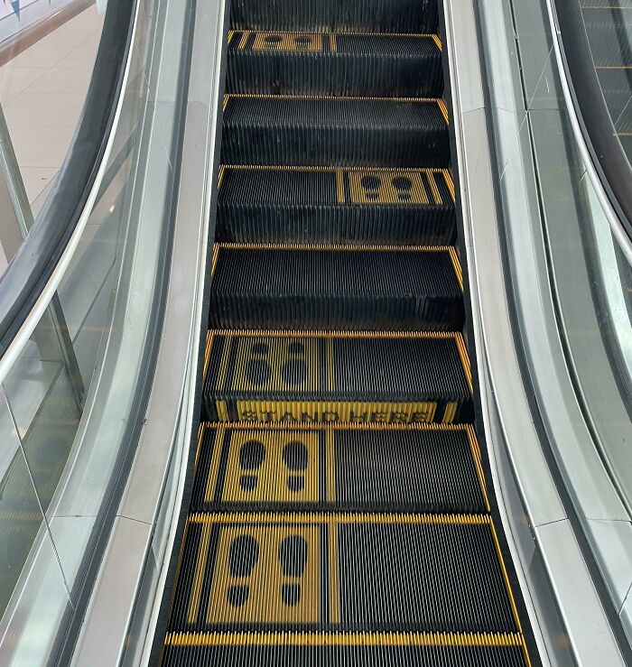Escalator steps with mismatched footprint directions showcasing a classic "You Had One Job" fail.