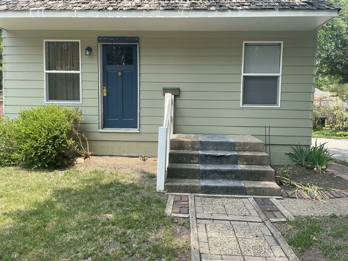 House with misaligned steps leading to a wall, showcasing a classic “You Had One Job” fail.