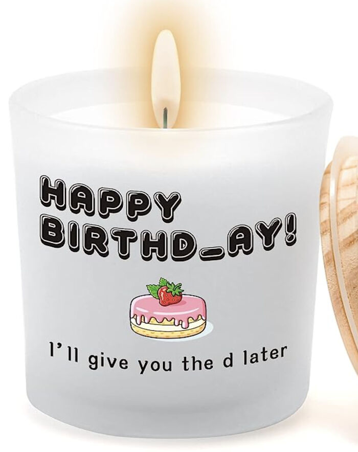 Candle with a humorous typo reading "Happy Birthd_ay!" showcasing a fail.