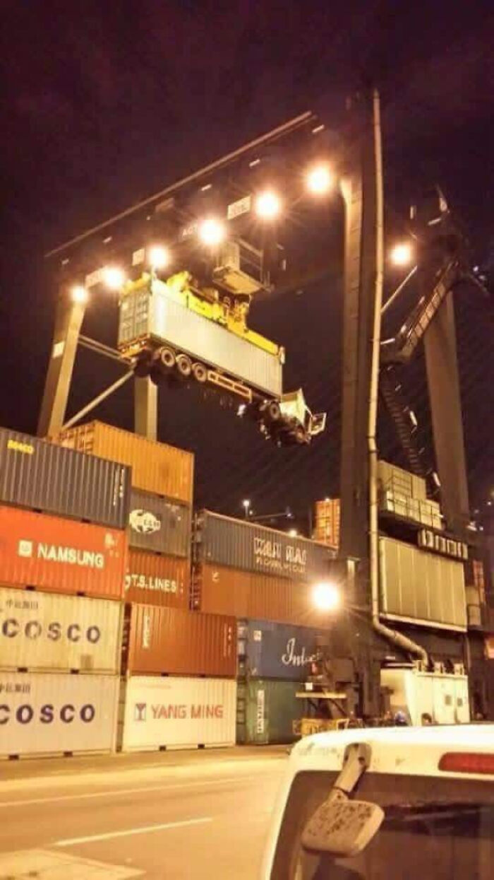 Crane lifting truck instead of container, a classic “You Had One Job” fail at a shipping yard.