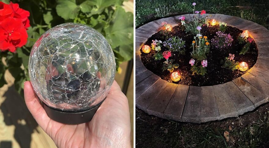 Hand holding a crackled glass garden gadget beside a flower bed lit by multiple glowing garden gadgets at night.