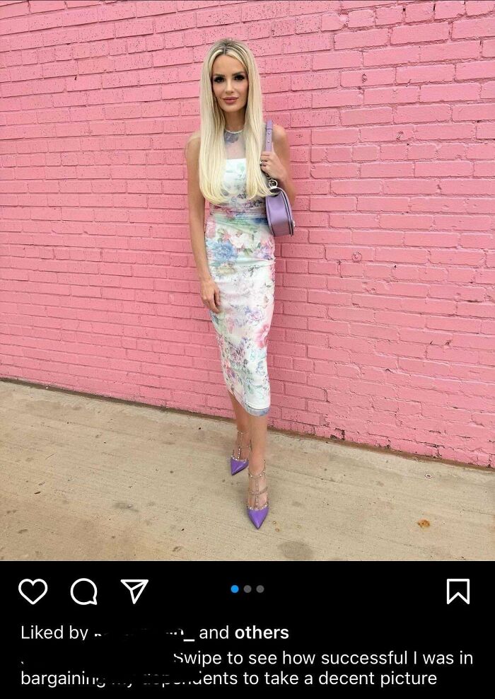 Woman in floral dress posing against a pink brick wall, illustrating Instagram vs reality photos with fashion and style contrast.