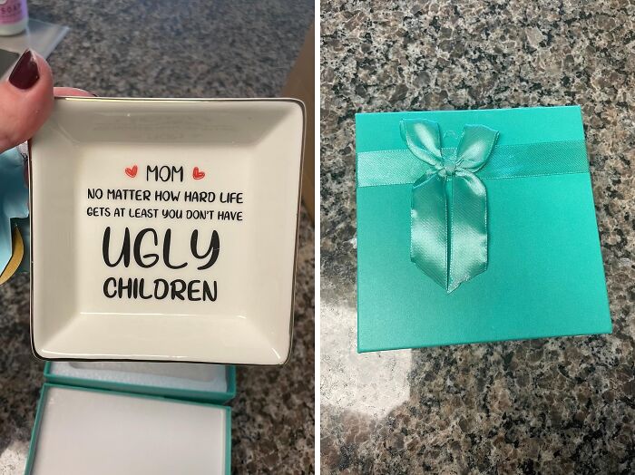 Ceramic dish with funny Mother's Day gift quote and teal gift box with ribbon on a granite countertop.
