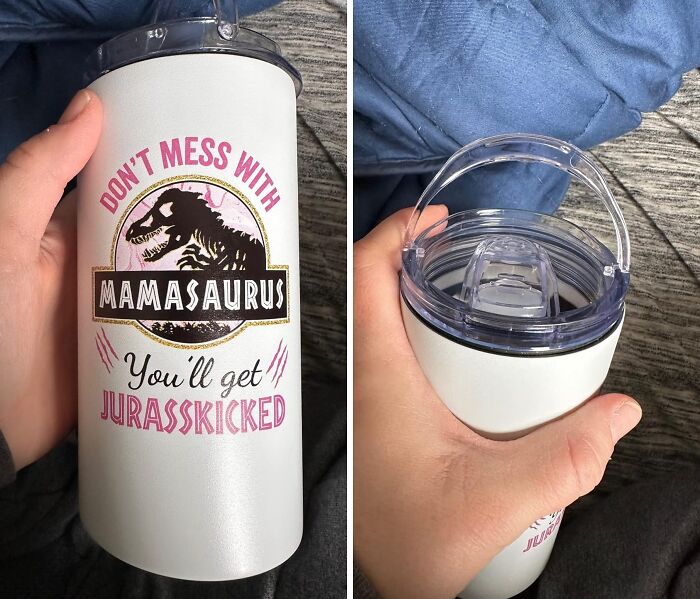 Funny Mother's Day gift tumbler with "Don't mess with Mamasaurus" dinosaur design held by hand on gray fabric background.