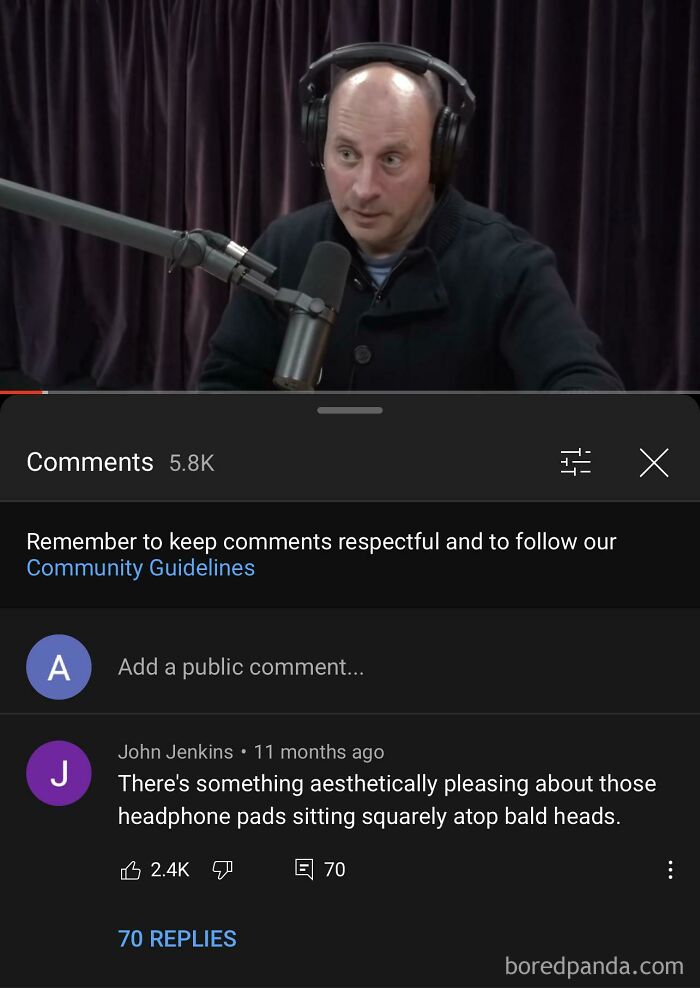 Man with headphones and a microphone receiving a rare compliment online about his bald head.