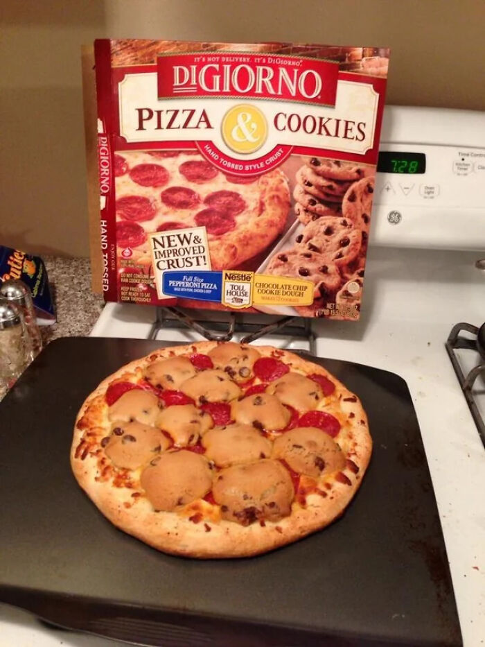 Pizza topped with chocolate chip cookies on a baking tray in front of a DiGiorno pizza and cookies box.