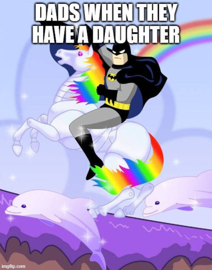 Batman riding a rainbow-maned unicorn with dolphins in a whimsical funny dad photo illustration.