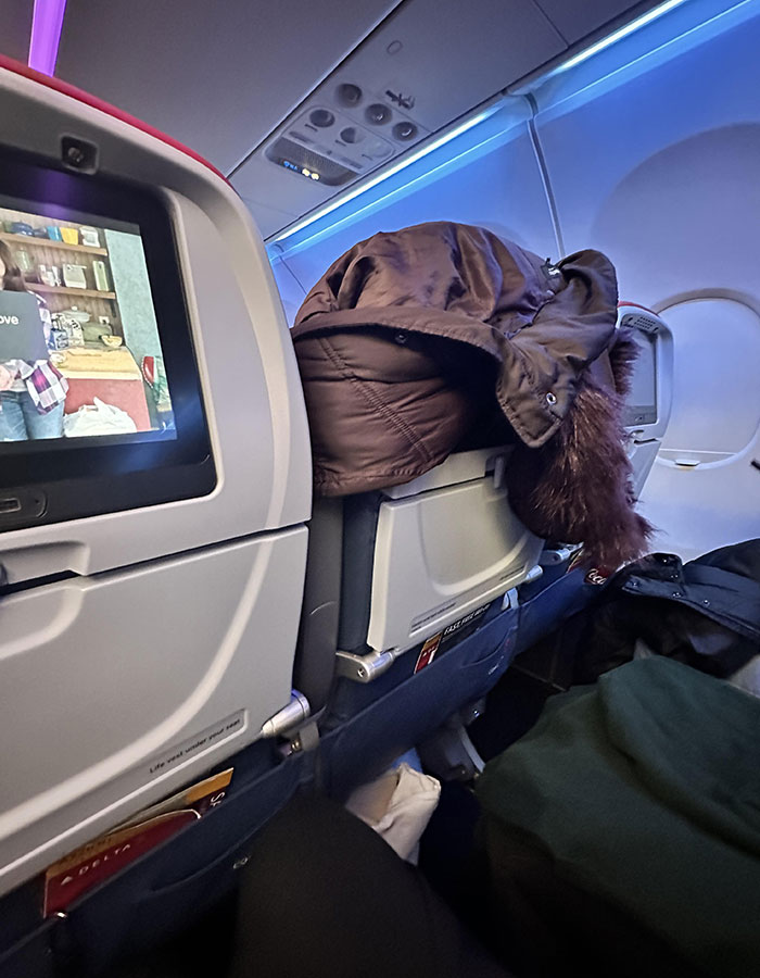 Woman&rsquo;s Flying Faux Pas Sparks Heated Debate About Flight Etiquette