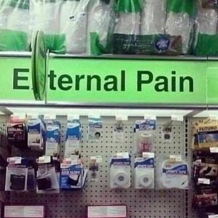 Store aisle sign humorously labeled "Eternal Pain" for mental health memes.