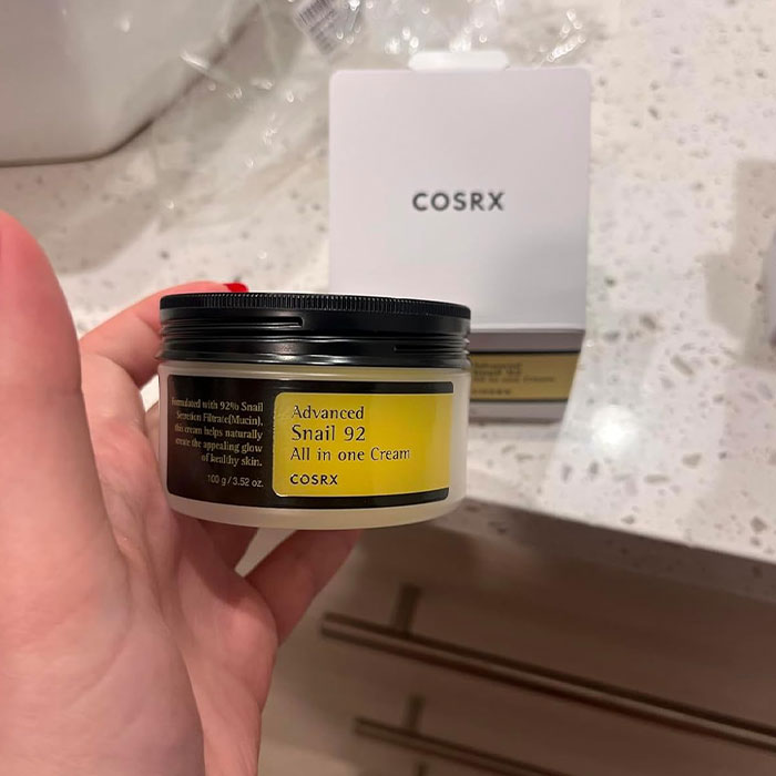 COSRX Advanced Snail 92 cream held in hand, perfect cheap and cheerful Mother's Day gift under $20.