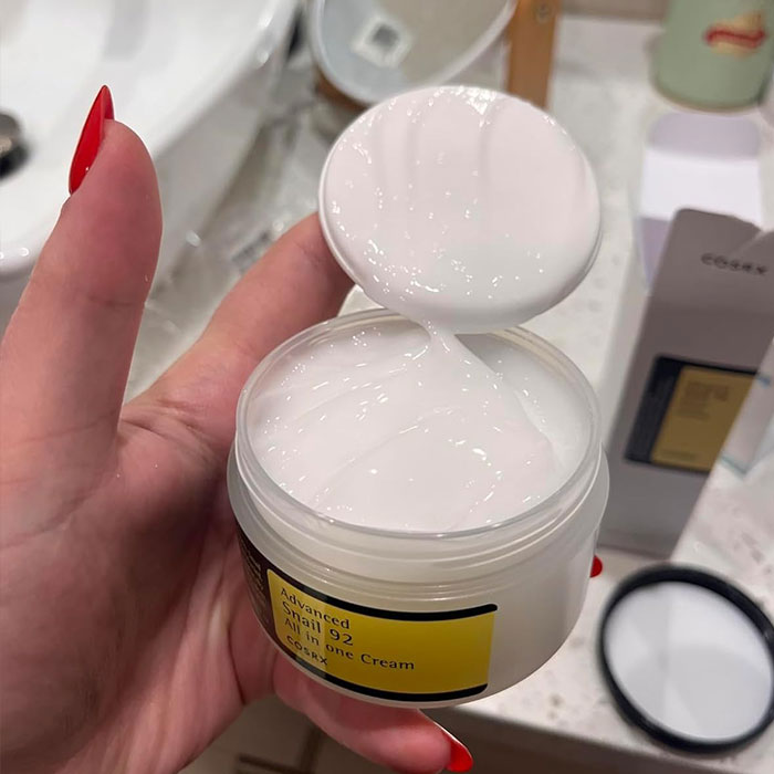 COSRX Advanced Snail 92 cream held in hand, perfect cheap and cheerful Mother's Day gift under $20.
