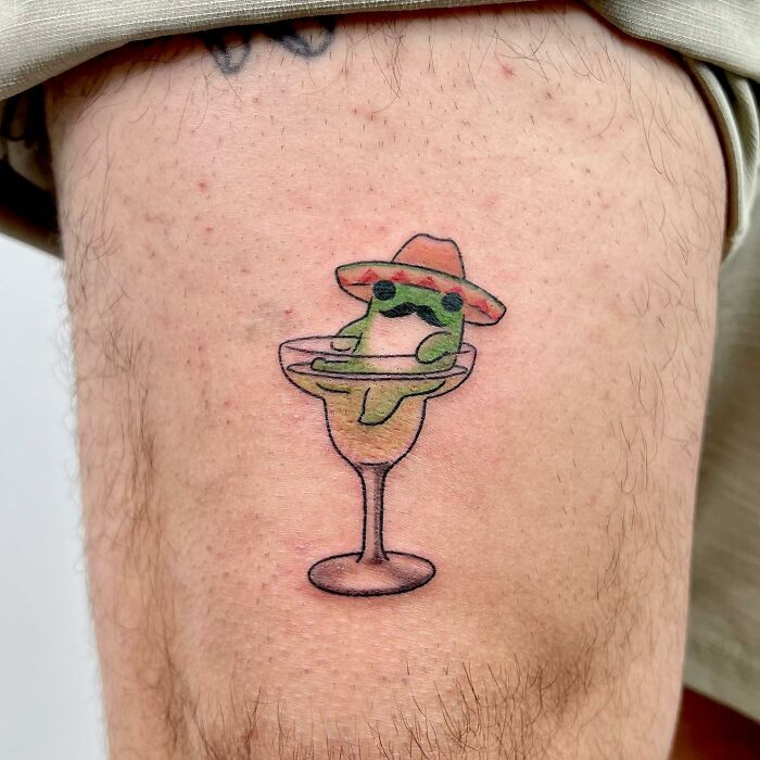 Charming tattoo by Buoy featuring a cute frog in a margarita glass with a sombrero.